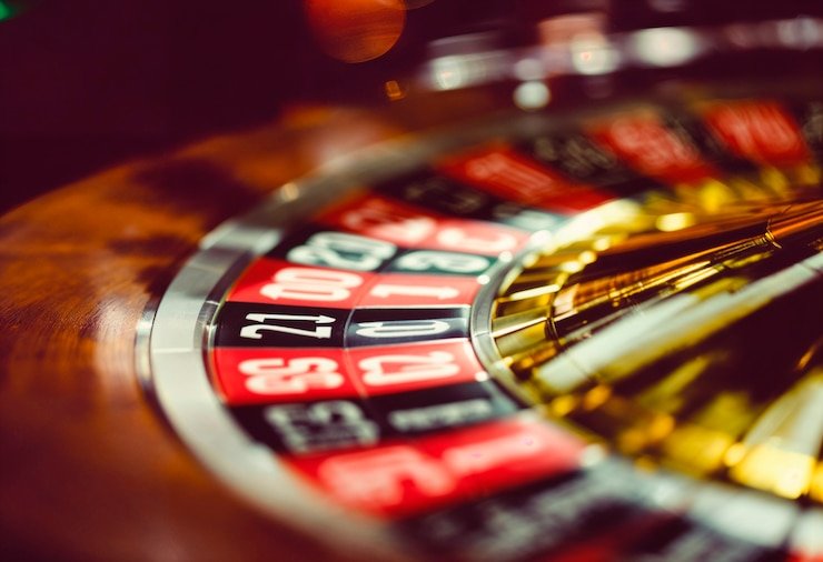 Dealer conducting live spin with ball in motion on the wheel